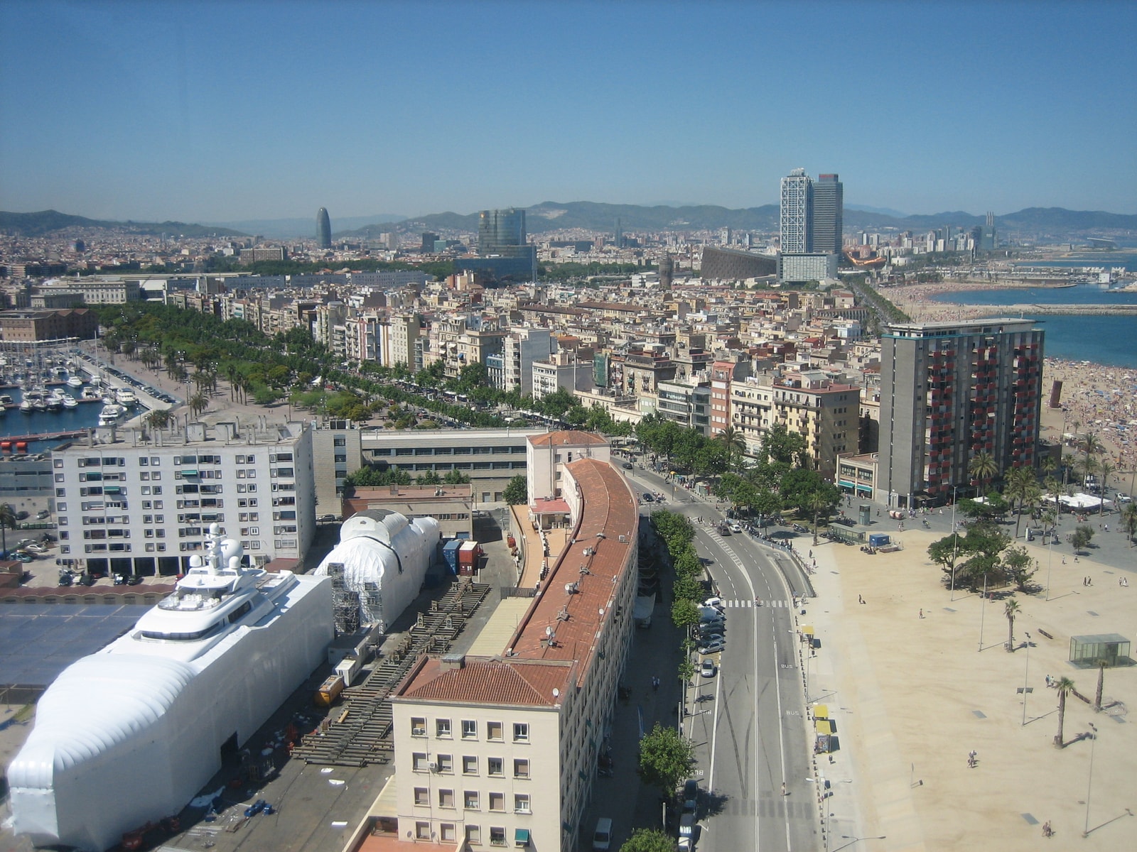 An elevated view shows the tight grid of narrow streets and residential buildings that make up the historic Barceloneta neighborhood.