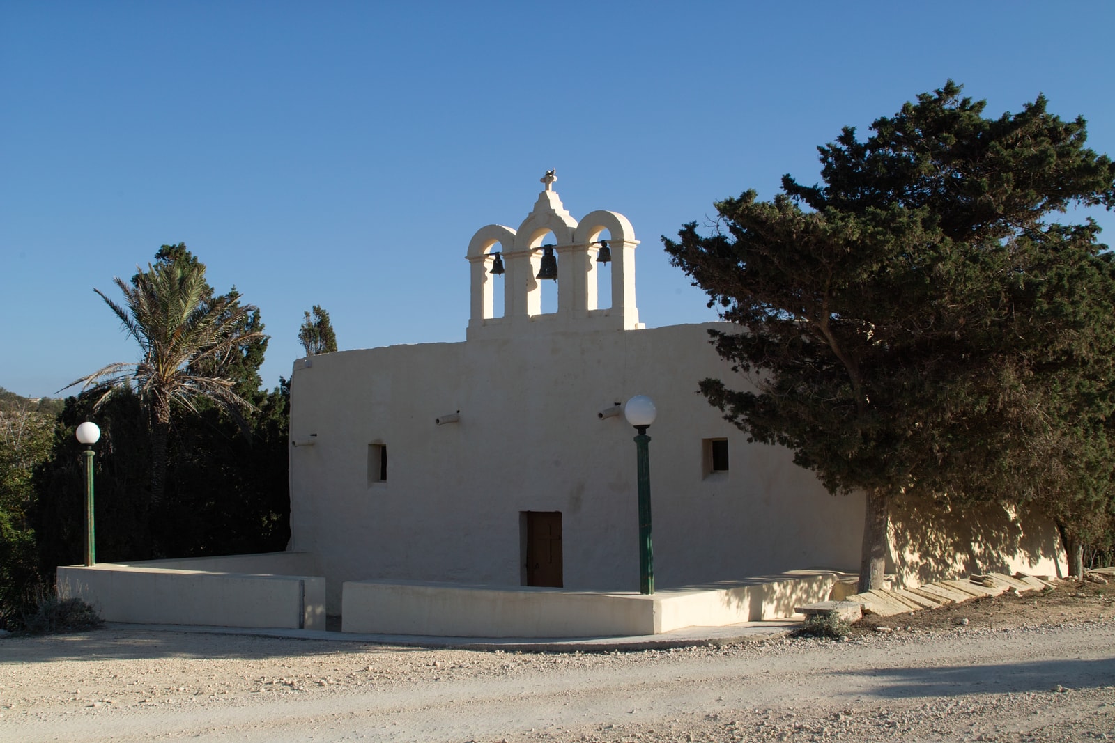 The small, rustic facade of the Comino Chapel.