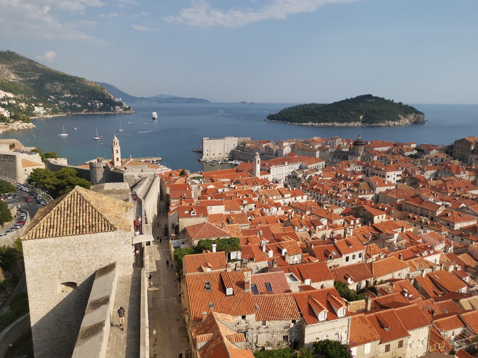An elevated view of Dubrovnik, showing the Old Town, its fortifications, and the coastline.