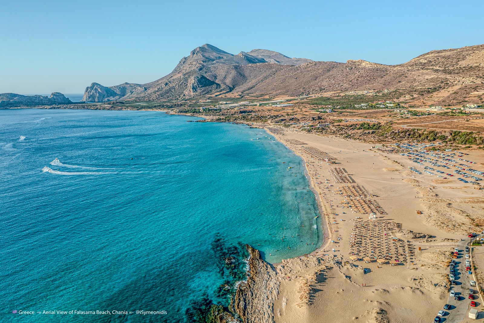 A drone photograph captures the impressive scale and length of the Falassarna coastline.