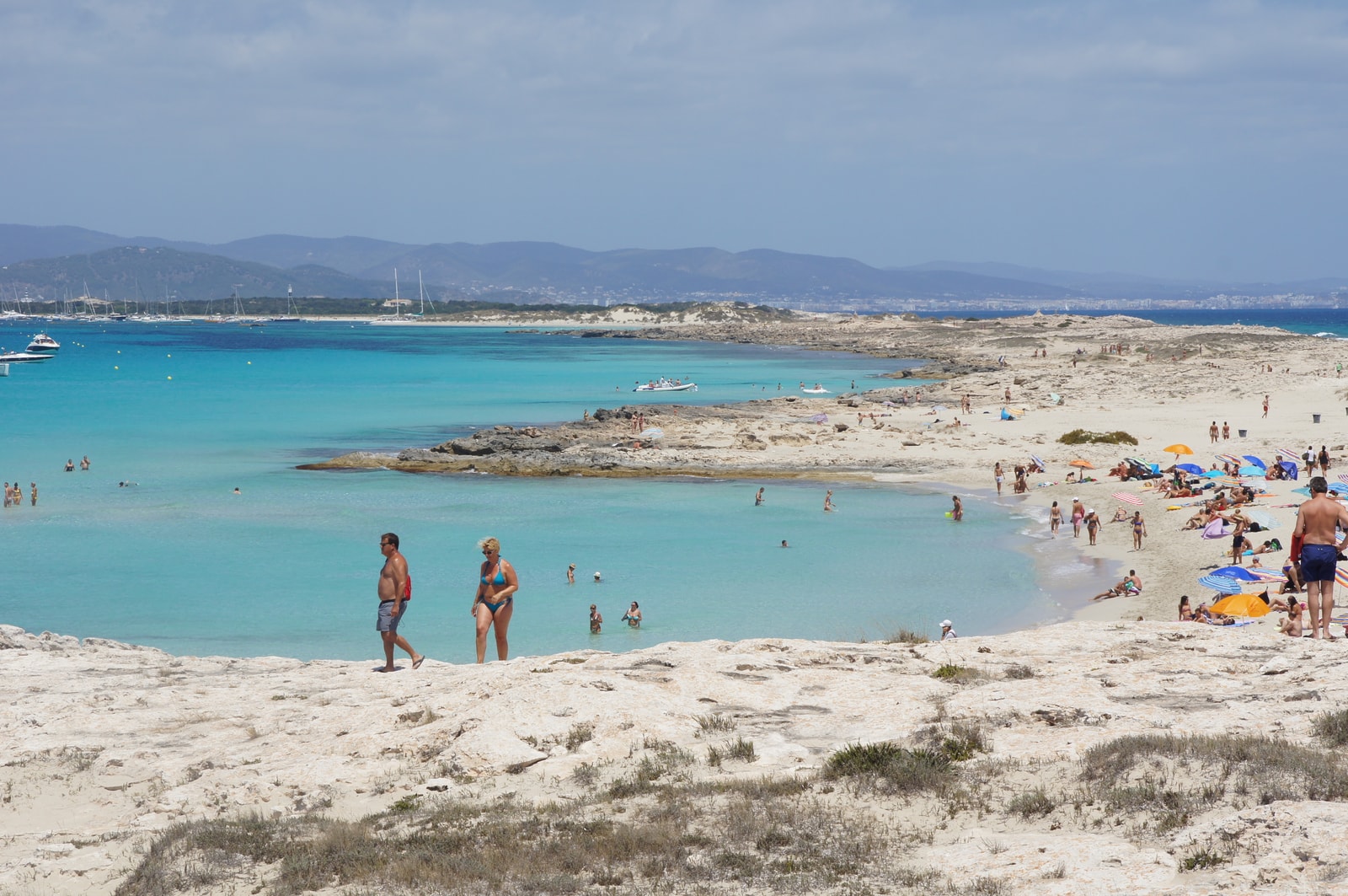 A narrow sandbar at Playa de Ses Illetes, Formentera, with incredibly clear turquoise water on both sides.