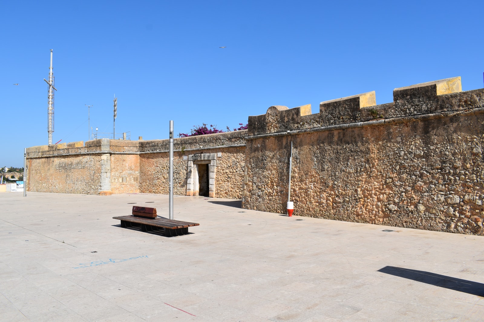 A view of the stone walls and plaza of the Forte de Santa Catarina in Portimão.