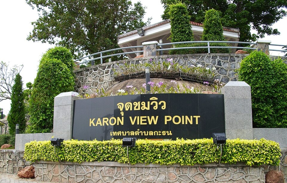 A wide panoramic shot from Karon Viewpoint captures the expansive coastline and multiple bays.