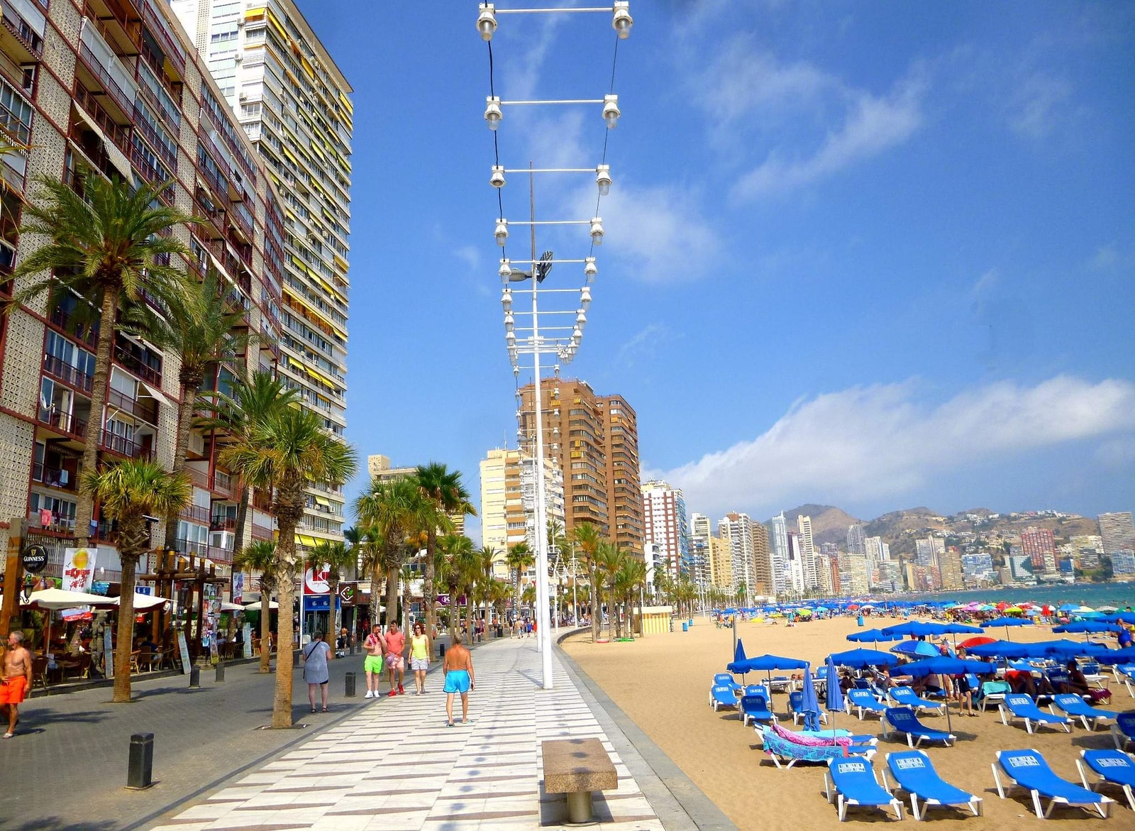 Vibrant resort lifestyle on Levante’s promenade with palm trees.