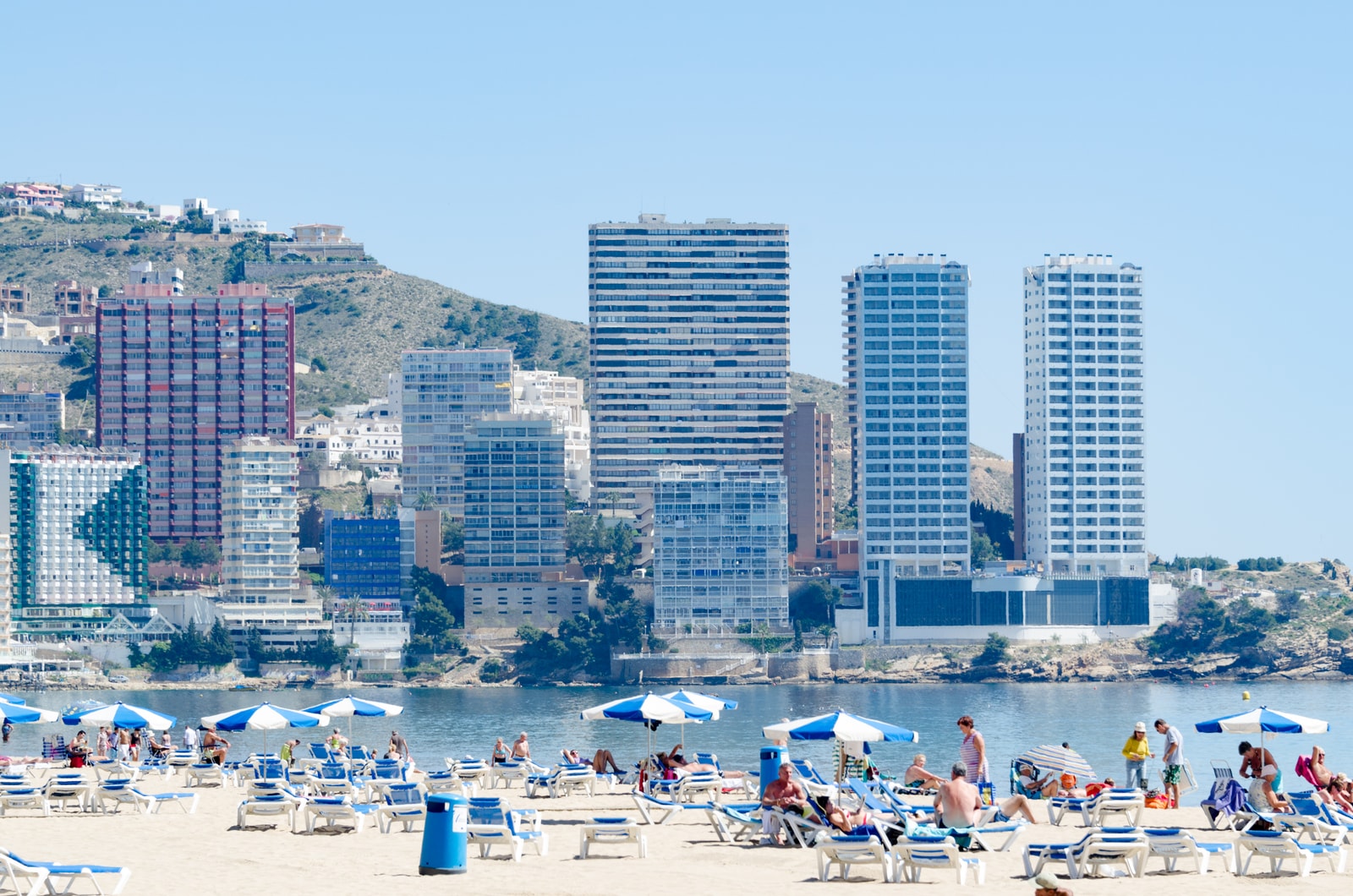 Low-angle shot showing skyscrapers rising behind Levante Beach.