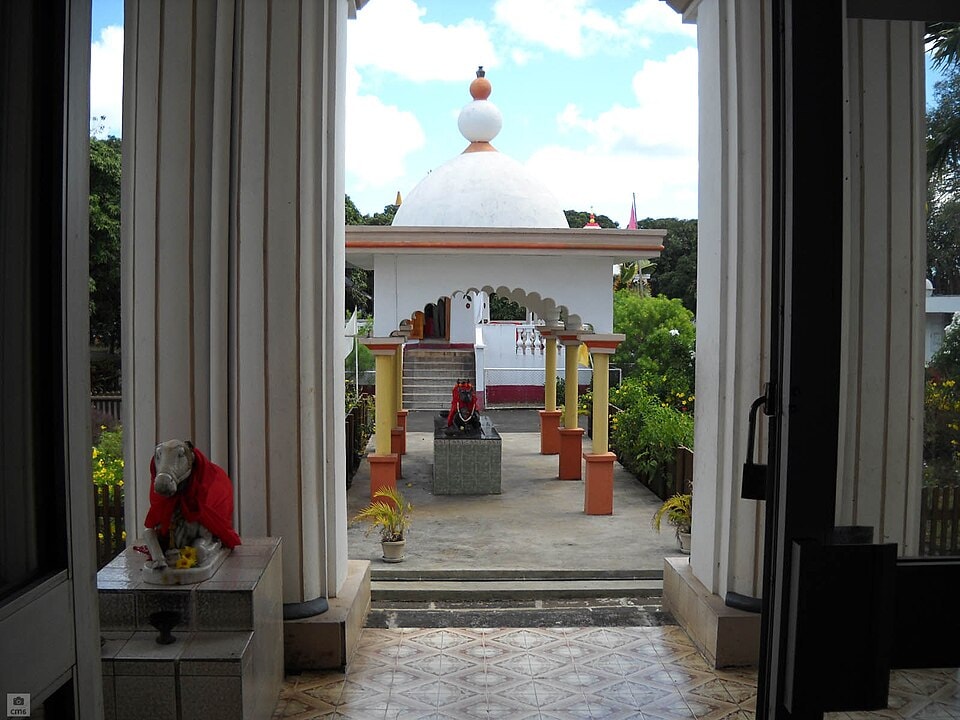 A detailed, ornate shrine with colorful statues of deities at the Maheswarnath Mandir temple.