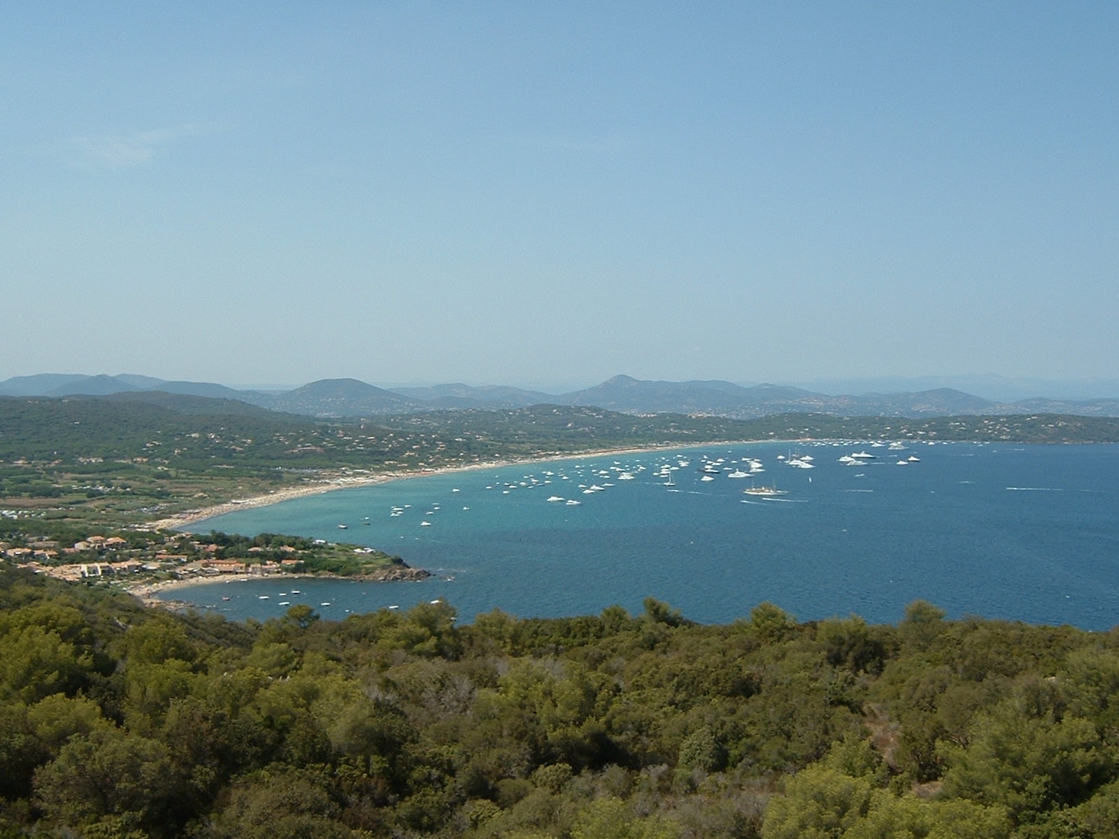 A high-altitude panorama showing the sandy crescent of Pampelonne merging with the headlands of Bonne Terrasse.