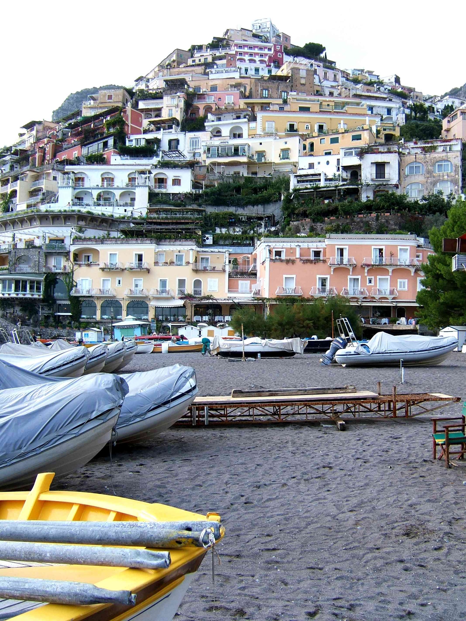 A view of Positano's dense hillside rising behind the waterfront