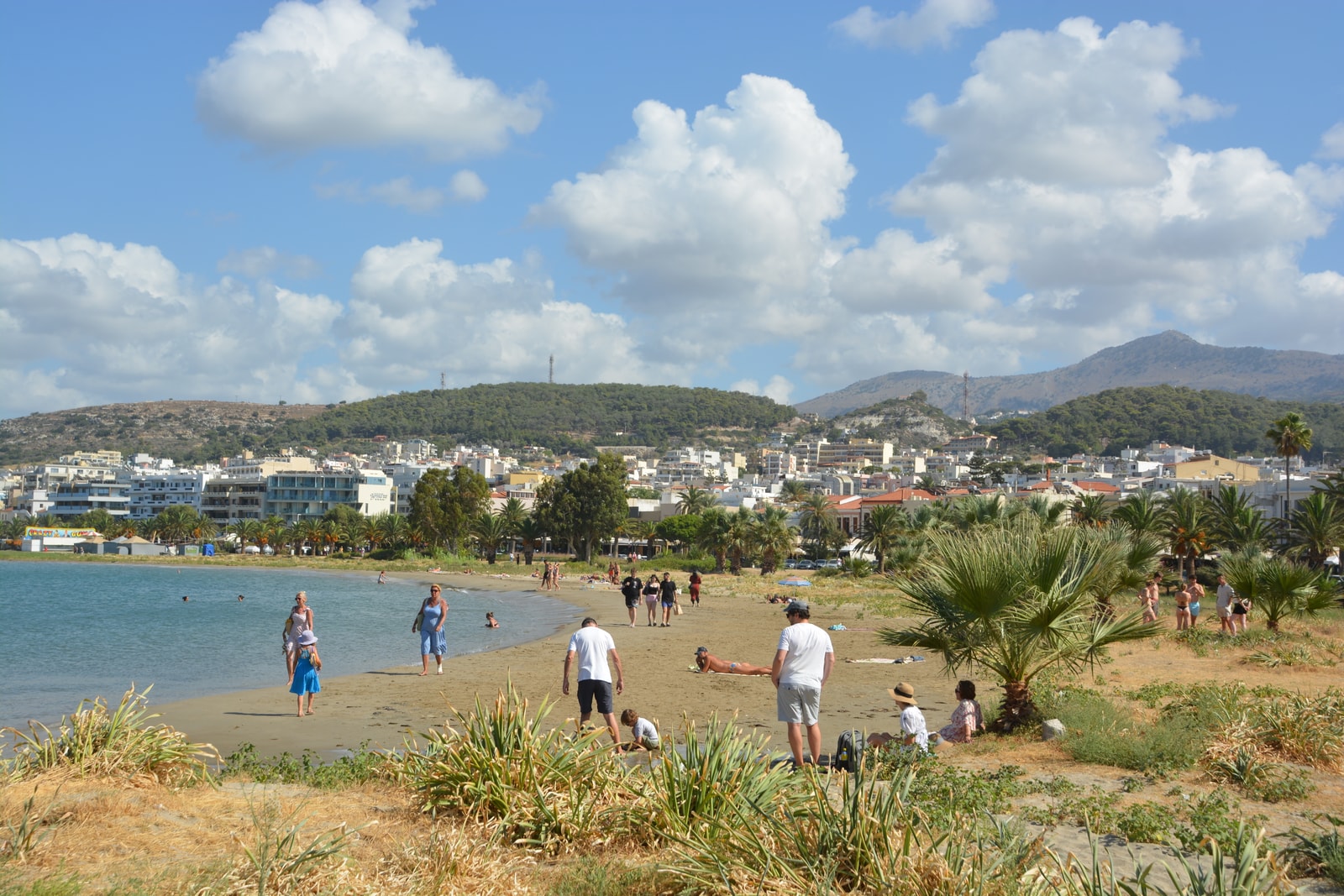 Rethymno's main beach with the town and mountains in the background