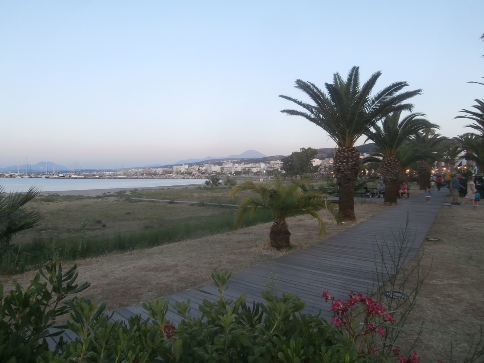 A wooden walkway provides access along the beach in Rethymno