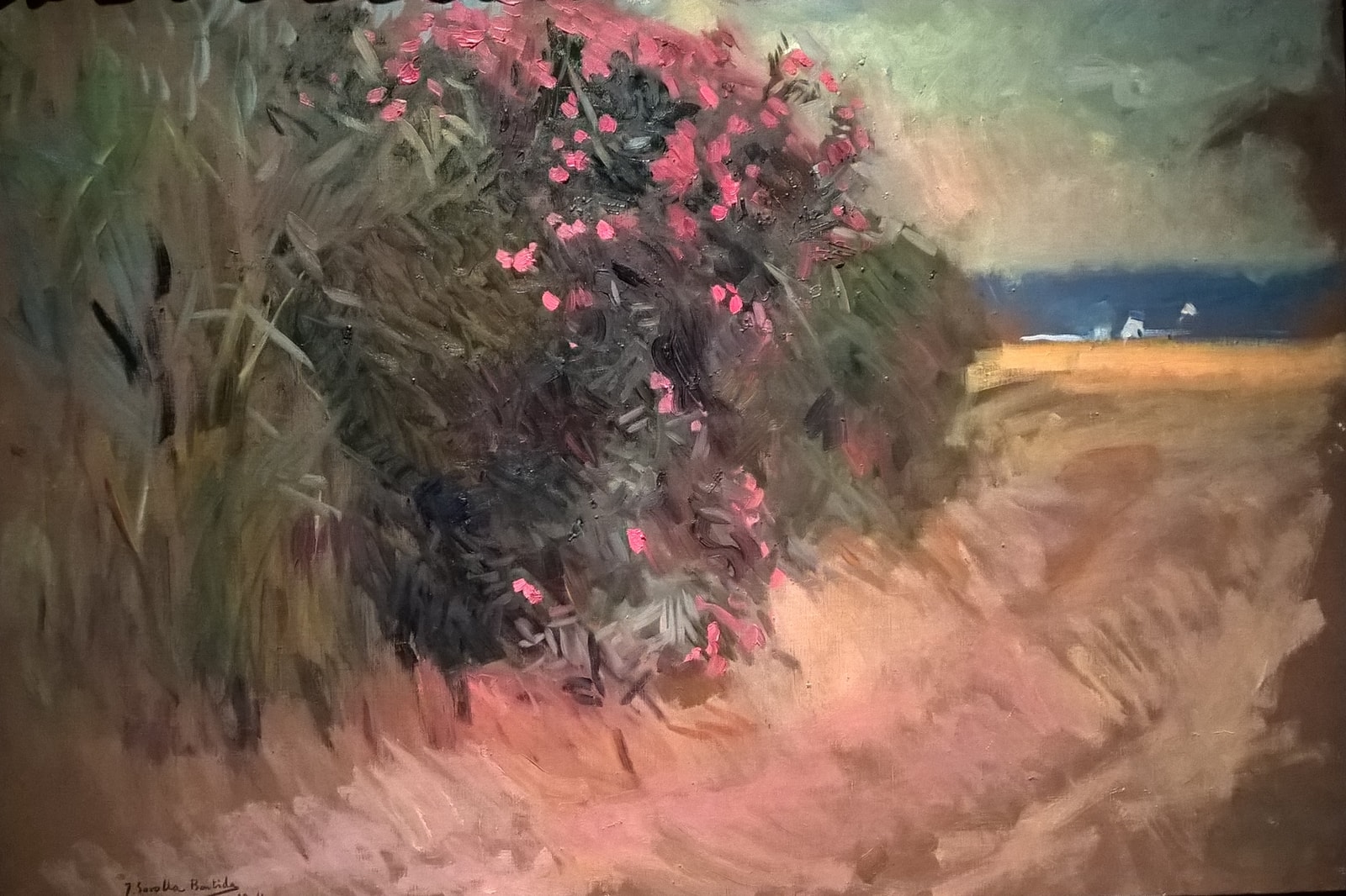 A reproduction of Joaquín Sorolla's impressionistic painting, showing figures on the sunny shores of Malvarrosa beach.