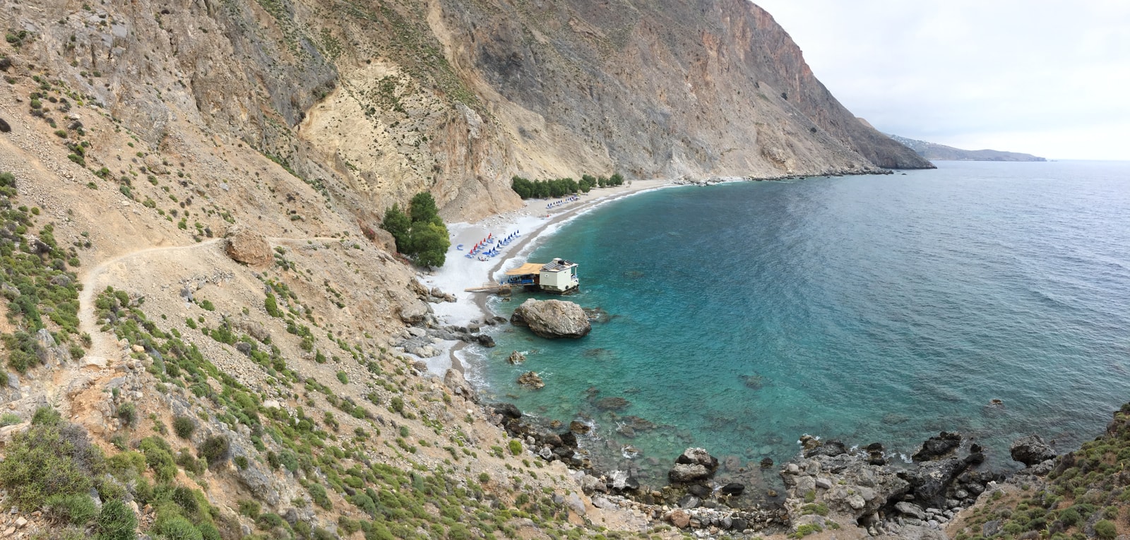 The remote Sweetwater Beach is framed by immense, sheer cliffs that drop into the Libyan Sea.