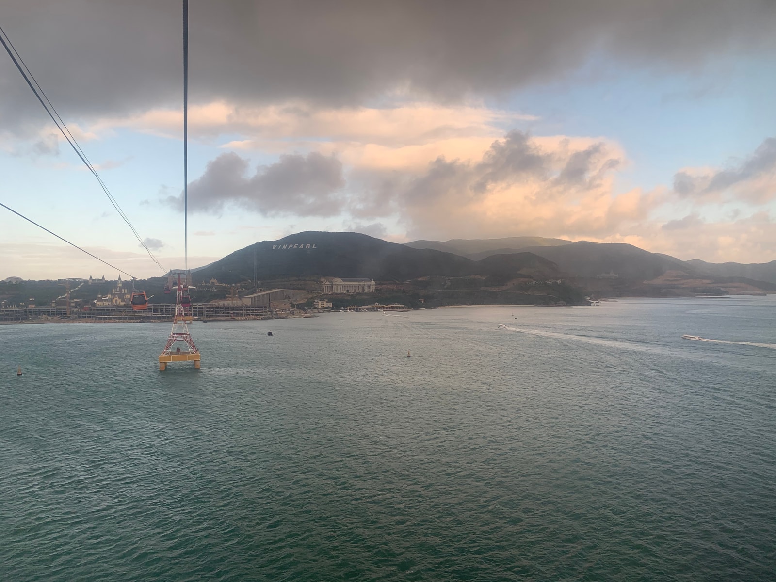 A view of the Vinpearl cable car line stretching over the water towards the mountains of Hon Tre Island.