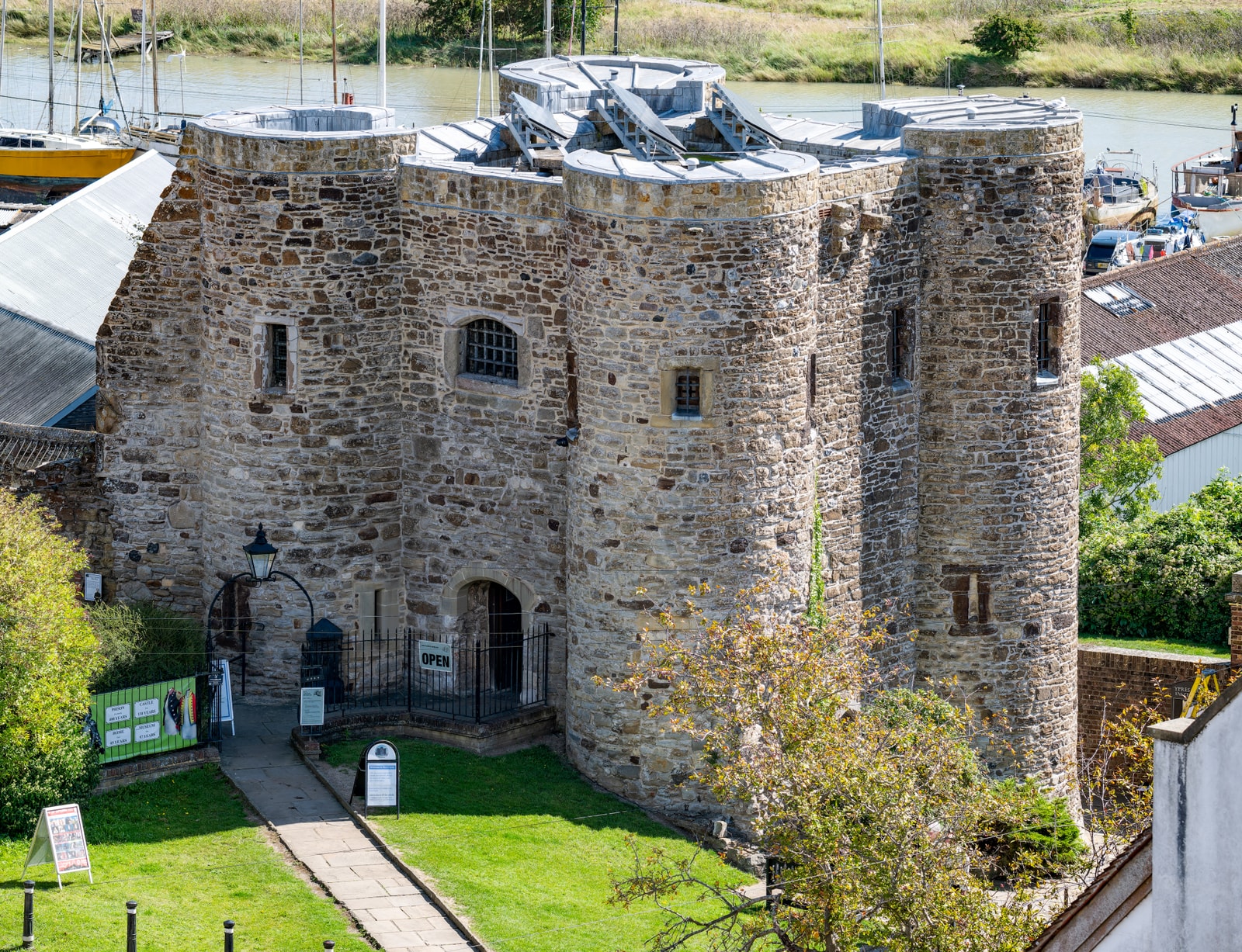 A high-angle view of the medieval stone Ypres Tower overlooking Rye Harbour.